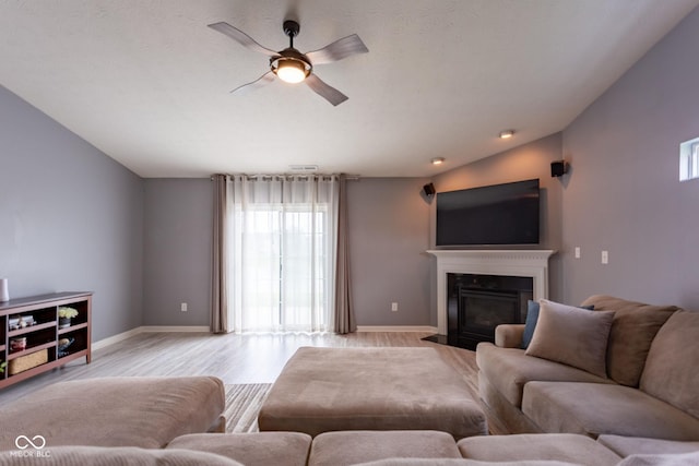 4353 W Parkway Ct, New Palestine, IN 46163 - living room with plenty of natural light, ceiling fan, baseboards, and a fireplace with flush hearth