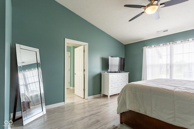 4353 W Parkway Ct, New Palestine, IN 46163 - bedroom featuring wood finished floors, baseboards, connected bathroom, high vaulted ceiling, and ceiling fan