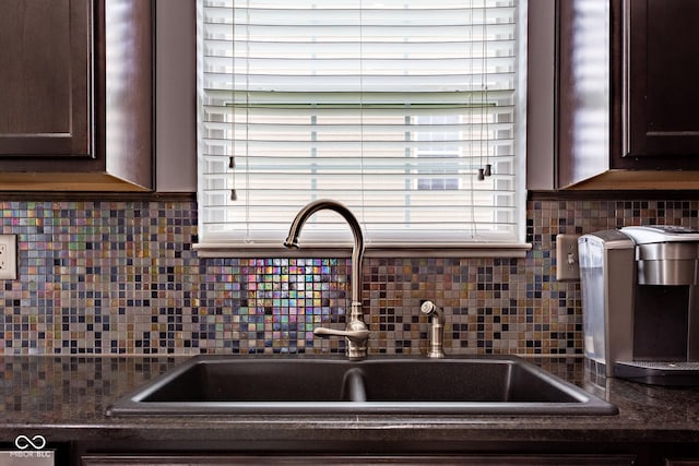 4353 W Parkway Ct, New Palestine, IN 46163 - kitchen view of a sink, dark brown cabinets, dark countertops, and tasteful backsplash
