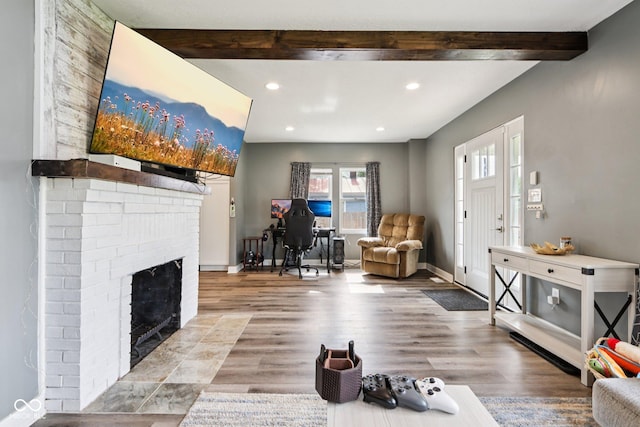 2928 Mounds Rd, Anderson, IN 46016 - living area featuring a fireplace, recessed lighting, beam ceiling, and wood finished floors