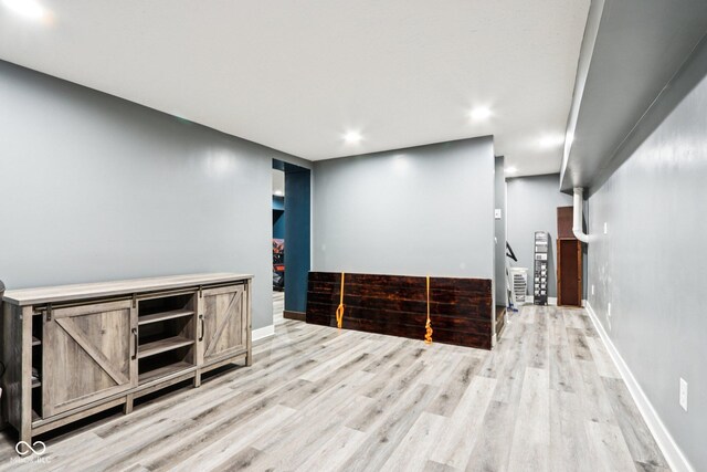 2928 Mounds Rd, Anderson, IN 46016 - spare room featuring stairs, wood finished floors, and recessed lighting