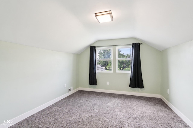 2928 Mounds Rd, Anderson, IN 46016 - additional living space with vaulted ceiling and carpet flooring