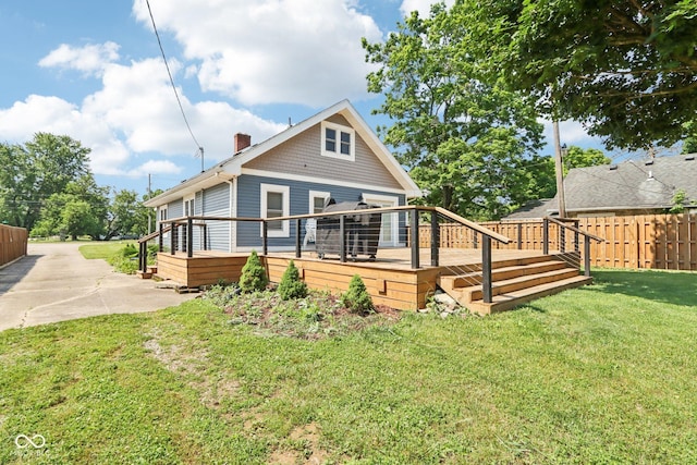 2928 Mounds Rd, Anderson, IN 46016 - rear view of property with a chimney and a deck