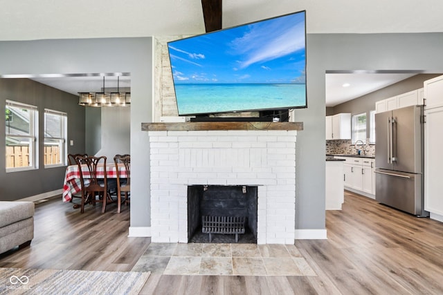 2928 Mounds Rd, Anderson, IN 46016 - living room featuring wood finished floors and plenty of natural light