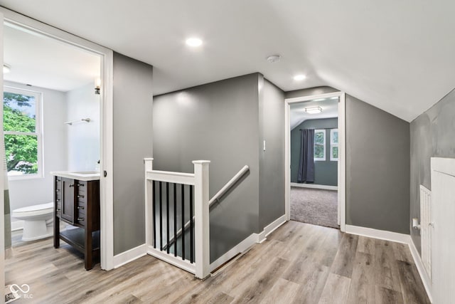 2928 Mounds Rd, Anderson, IN 46016 - corridor with an upstairs landing, light wood-type flooring, lofted ceiling, and recessed lighting