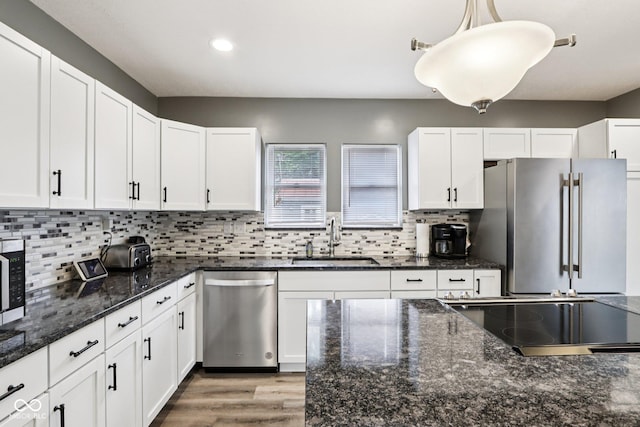 2928 Mounds Rd, Anderson, IN 46016 - kitchen featuring stainless steel appliances, recessed lighting, white cabinetry, backsplash, and light wood-type flooring