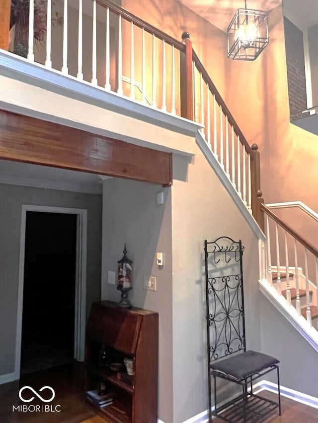 8310 Fall Creek Rd, Indianapolis, IN 46256 - stairs featuring a towering ceiling and wood finished floors