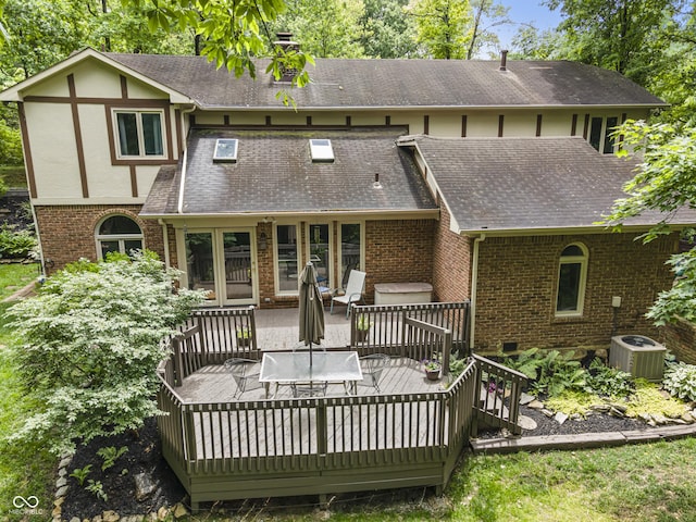 8310 Fall Creek Rd, Indianapolis, IN 46256 - rear view of property featuring brick siding, a wooden deck, roof with shingles, and a chimney
