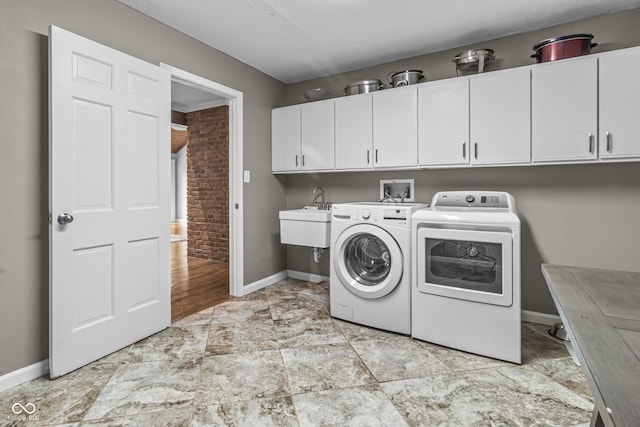 8310 Fall Creek Rd, Indianapolis, IN 46256 - laundry room featuring cabinet space and washing machine and dryer