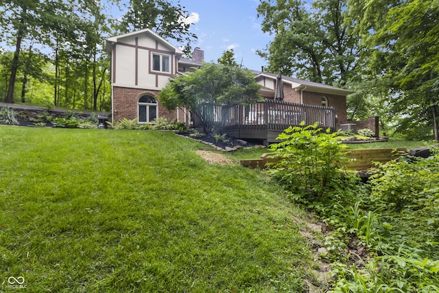 8310 Fall Creek Rd, Indianapolis, IN 46256 - rear view of property featuring brick siding, a lawn, a deck, and a chimney