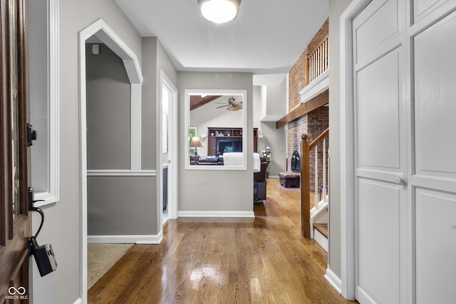 8310 Fall Creek Rd, Indianapolis, IN 46256 - entryway with wood finished floors, ceiling fan, and stairs