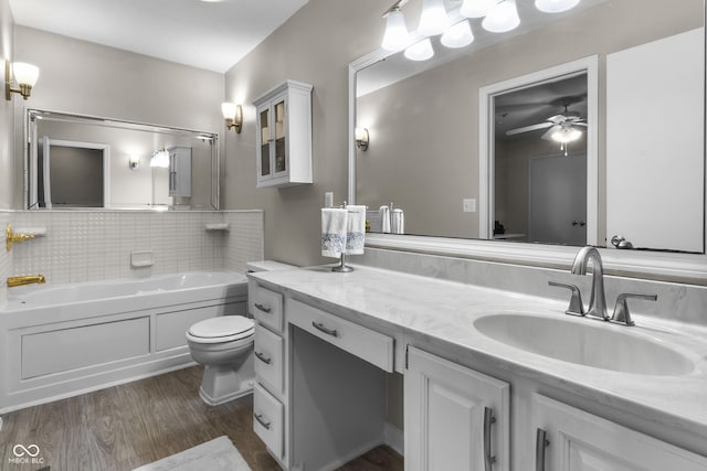 8310 Fall Creek Rd, Indianapolis, IN 46256 - bathroom with a ceiling fan, wood finished floors, a garden tub, and vanity