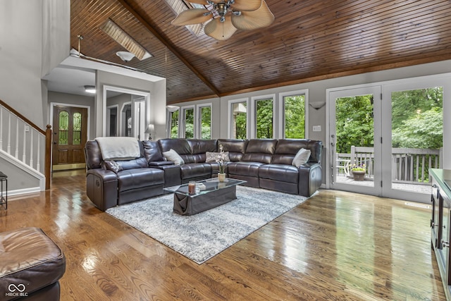 8310 Fall Creek Rd, Indianapolis, IN 46256 - living area featuring a wood ceiling with exposed beams, stairs, ceiling fan, wood finished floors, and high vaulted ceiling