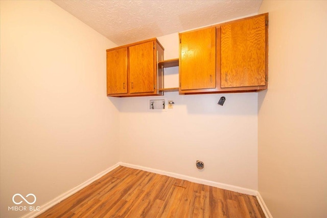 640 Shady Creek Ct, Greenwood, IN 46142 - washroom with cabinet space, wood finished floors, a textured ceiling, baseboards, and hookup for a washing machine