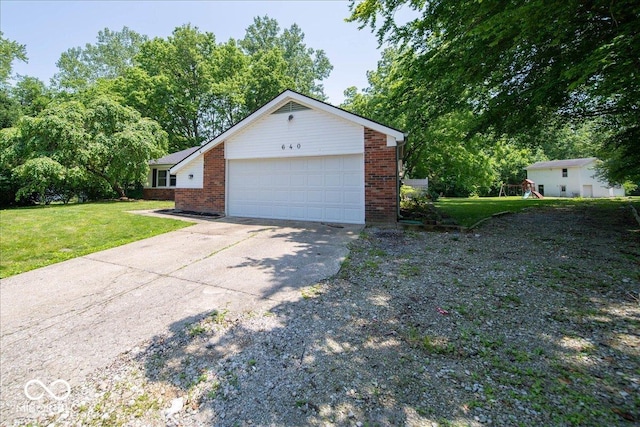 640 Shady Creek Ct, Greenwood, IN 46142 - view of side of property with brick siding, a yard, a playground, and concrete driveway