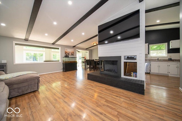 640 Shady Creek Ct, Greenwood, IN 46142 - living room with light wood-style flooring, a fireplace, baseboards, and recessed lighting