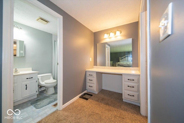 640 Shady Creek Ct, Greenwood, IN 46142 - full bathroom with vanity, toilet, a textured ceiling, and baseboards