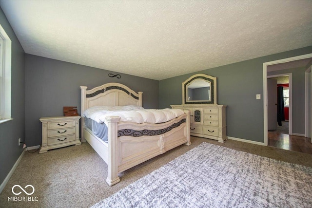 640 Shady Creek Ct, Greenwood, IN 46142 - bedroom featuring carpet, a textured ceiling, and baseboards