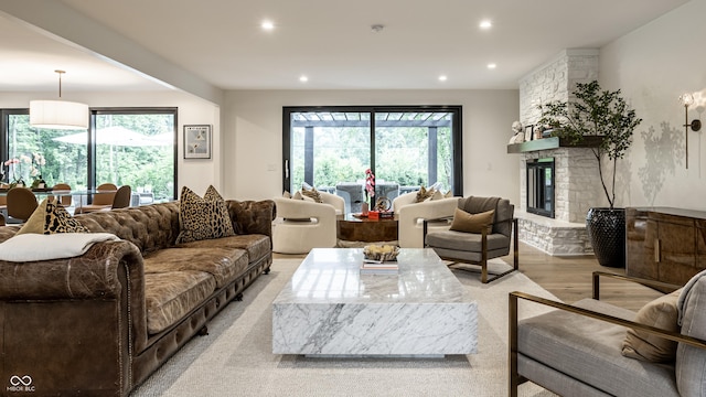 3549 W 131st St, Carmel, IN 46032 - living room featuring light wood-style flooring, recessed lighting, and a fireplace