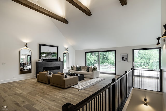 3549 W 131st St, Carmel, IN 46032 - living room featuring high vaulted ceiling, beam ceiling, wood finished floors, and a fireplace