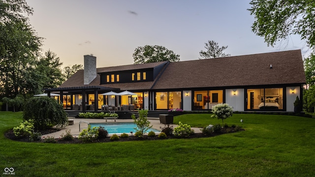 3549 W 131st St, Carmel, IN 46032 - rear view of house with a chimney, a pergola, a yard, an outdoor pool, and roof with shingles