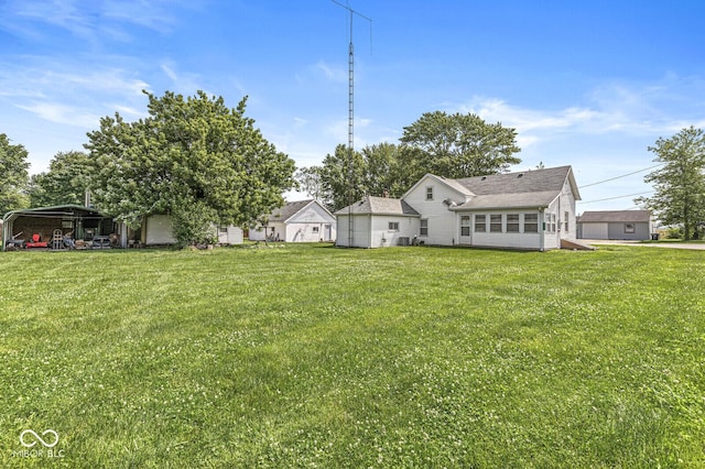 9290 Vine St, Manilla, IN 46150 - rear view of house with a lawn and a carport