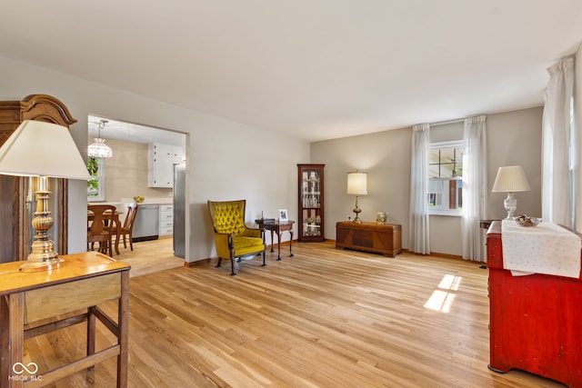 1010 Maple St, Greenwood, IN 46142 - sitting room with light wood finished floors and baseboards