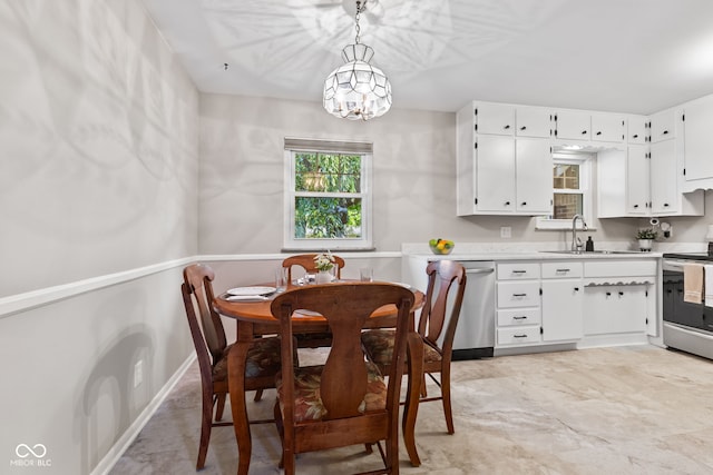 1010 Maple St, Greenwood, IN 46142 - dining area with a chandelier and baseboards