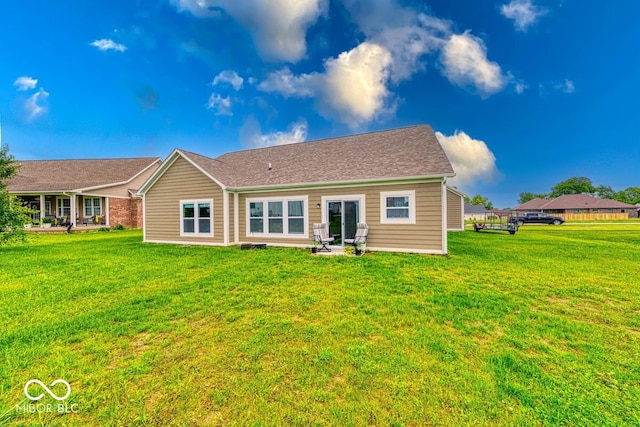 59 Manchester Dr, Trafalgar, IN 46181 - rear view of property featuring a lawn