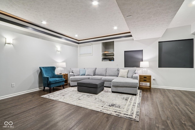 1345 Lewiston Dr, Westfield, IN 46074 - living area featuring a textured ceiling, dark wood-type flooring, a tray ceiling, and recessed lighting