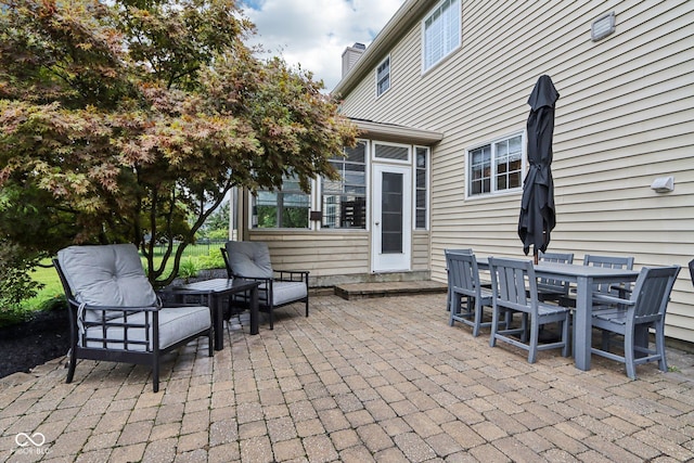 1345 Lewiston Dr, Westfield, IN 46074 - view of patio featuring a sunroom and outdoor dining space