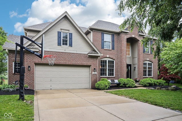 1345 Lewiston Dr, Westfield, IN 46074 - traditional home with brick siding, driveway, a front lawn, and roof with shingles