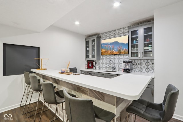 1345 Lewiston Dr, Westfield, IN 46074 - bar with dark wood-type flooring, backsplash, and recessed lighting