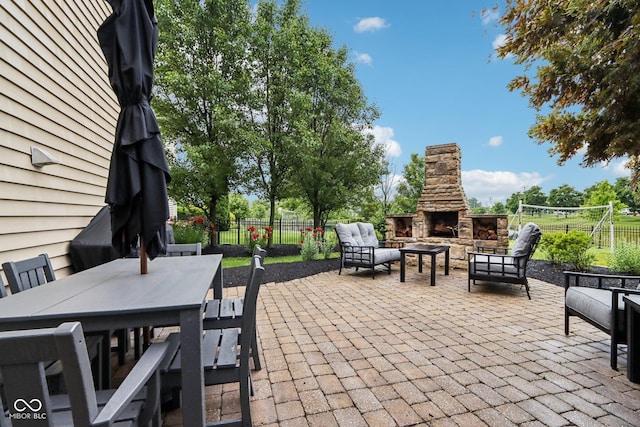 1345 Lewiston Dr, Westfield, IN 46074 - view of patio with an outdoor living space with a fireplace and outdoor dining space