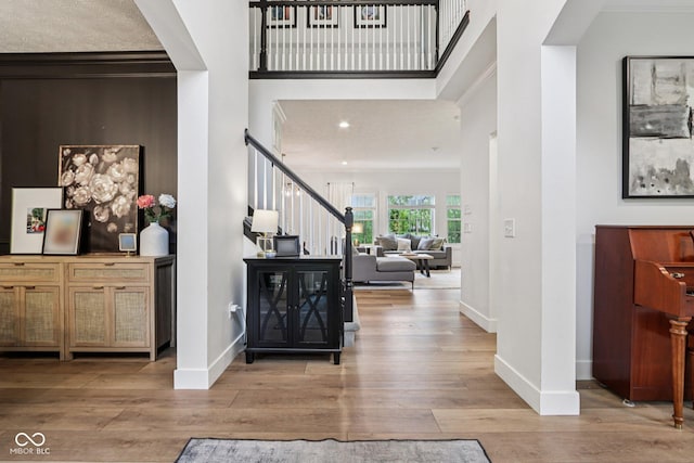 1345 Lewiston Dr, Westfield, IN 46074 - foyer entrance with stairway, wood finished floors, ornamental molding, recessed lighting, and a towering ceiling