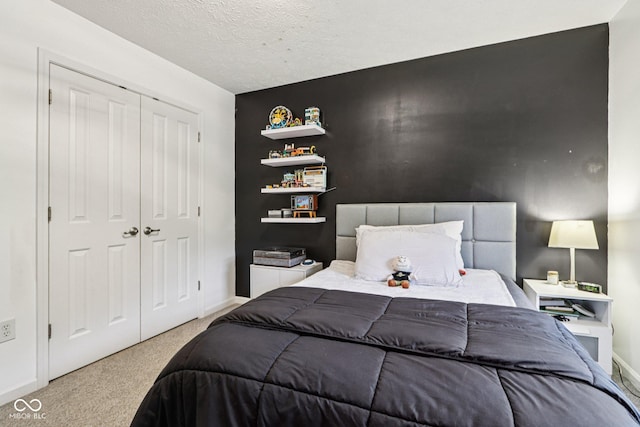 1345 Lewiston Dr, Westfield, IN 46074 - bedroom with carpet floors, a closet, and a textured ceiling
