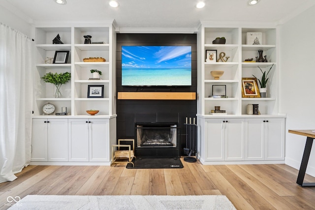 1345 Lewiston Dr, Westfield, IN 46074 - living room featuring light wood-type flooring, ornamental molding, a fireplace, and recessed lighting
