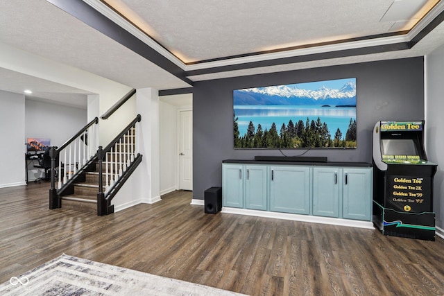1345 Lewiston Dr, Westfield, IN 46074 - unfurnished living room with dark wood-style flooring, stairway, a tray ceiling, a textured ceiling, and ornamental molding