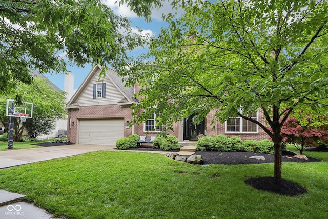 1345 Lewiston Dr, Westfield, IN 46074 - view of front facade featuring brick siding, driveway, an attached garage, and a front yard