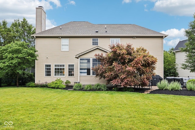 1345 Lewiston Dr, Westfield, IN 46074 - back of house featuring a chimney and a yard