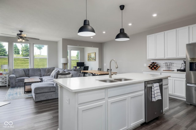 14110 Bay Willow Dr, Fishers, IN 46037 - kitchen with stainless steel appliances, open floor plan, light countertops, dark wood-style flooring, and recessed lighting