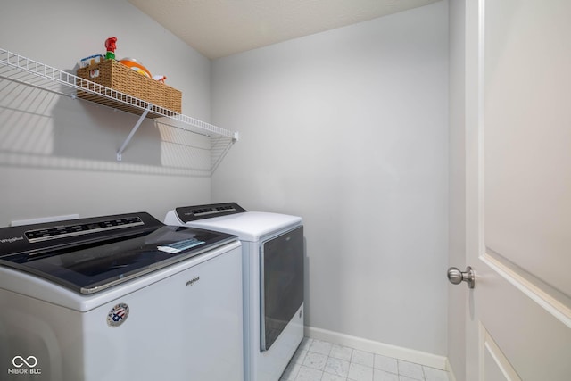 14110 Bay Willow Dr, Fishers, IN 46037 - laundry room with separate washer and dryer and baseboards