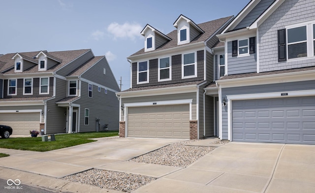 14110 Bay Willow Dr, Fishers, IN 46037 - view of front of home with a garage, driveway, and brick siding