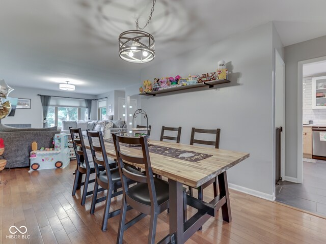 1504 Mcclure Rd, Columbus, IN 47201 - dining space featuring hardwood / wood-style flooring and baseboards