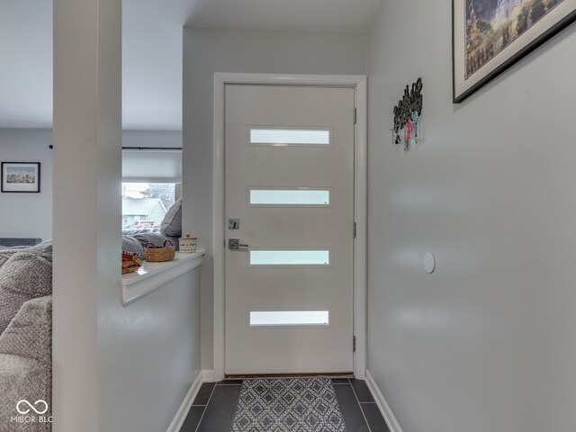 1504 Mcclure Rd, Columbus, IN 47201 - doorway featuring dark tile patterned floors and baseboards