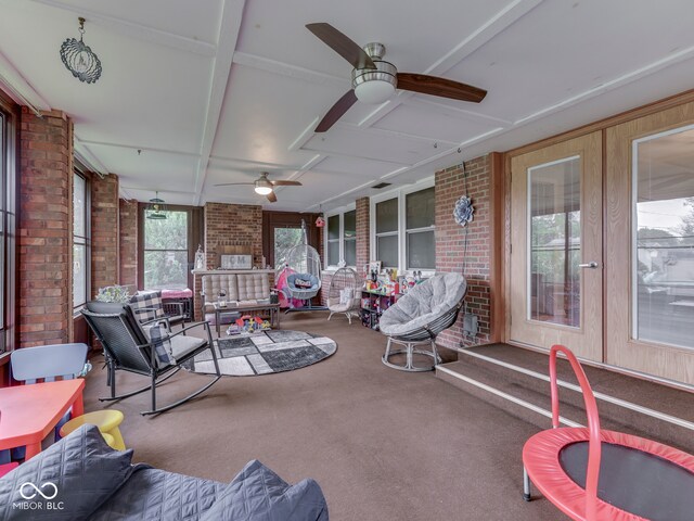 1504 Mcclure Rd, Columbus, IN 47201 - sunroom / solarium with ceiling fan, french doors, brick wall, and carpet flooring