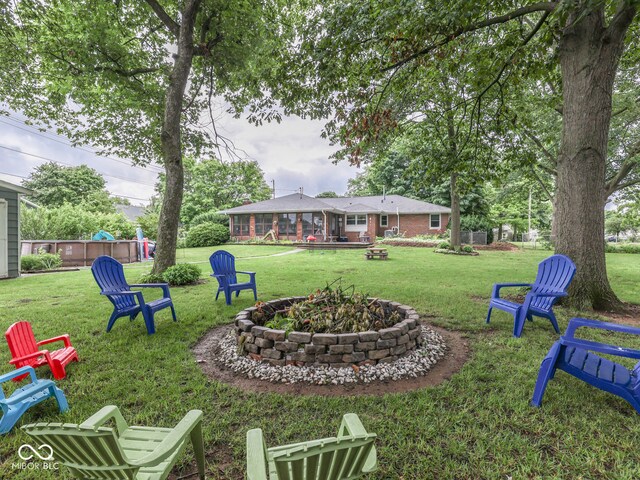 1504 Mcclure Rd, Columbus, IN 47201 - view of green lawn featuring an outdoor fire pit
