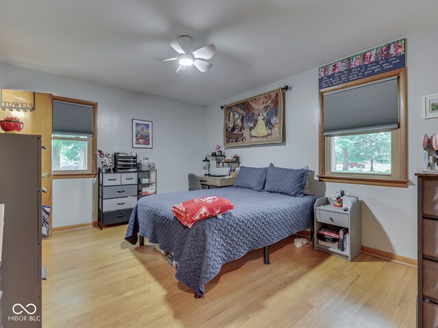 1504 Mcclure Rd, Columbus, IN 47201 - bedroom with light wood-type flooring, baseboards, and a ceiling fan