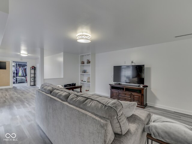 1504 Mcclure Rd, Columbus, IN 47201 - living room with baseboards and light wood-style flooring