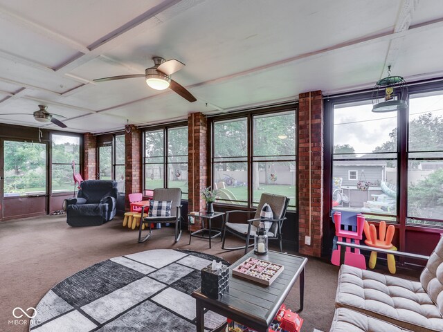 1504 Mcclure Rd, Columbus, IN 47201 - sunroom / solarium featuring a ceiling fan, carpet floors, and healthy amount of natural light